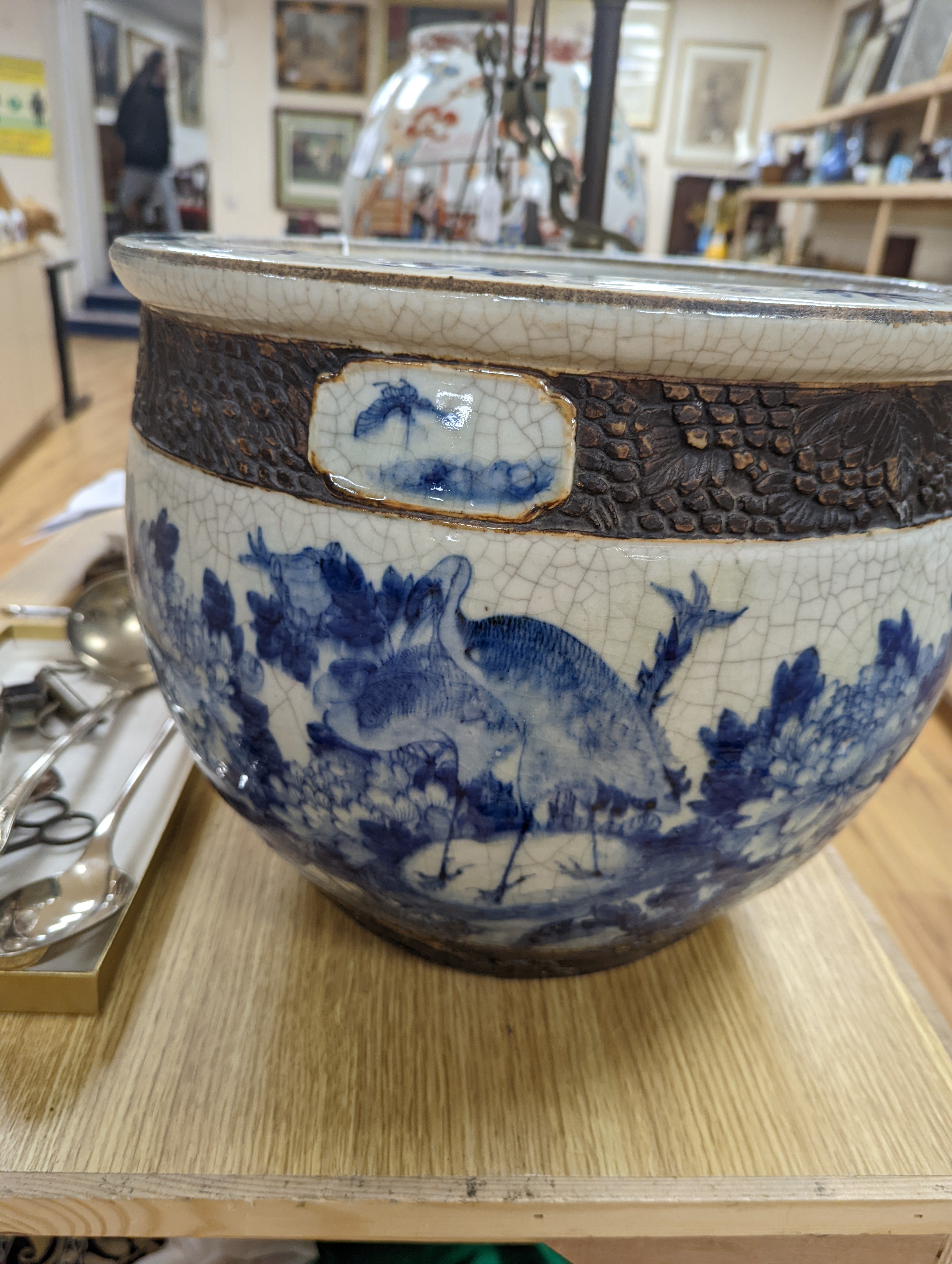 A late 19th/early 20th century Chinese blue and white crackleglaze jardiniere 30cm